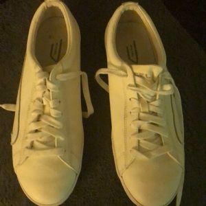 Men’s white Diesel shoes.